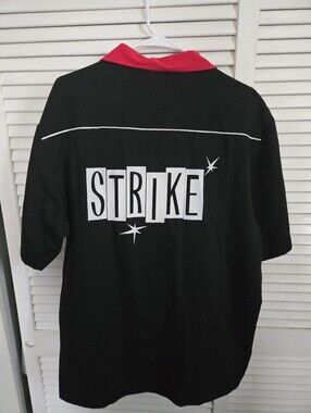 LG Black Short-Sleeve Polo with Red Collar and 'STRIKE' Graphic